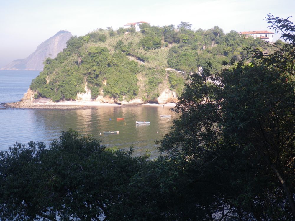 Small boats anchored in front of Boa Viagem island.