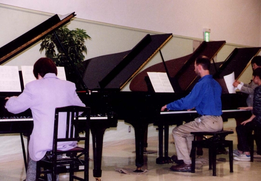Bruce Boiney, teacher from Louisville, Kentucky, performed the Paderewski Minuet, Op. 14, No. 1 in the concert. Here he is rehearsing next to Dr. Kataoka.